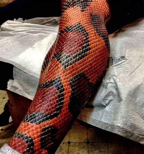 snake wrapped around leg tattoo|100+ Charming Snake Tattoo Designs with Meaning。